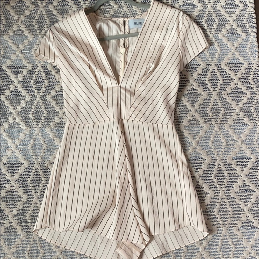 Black and cream colored romper